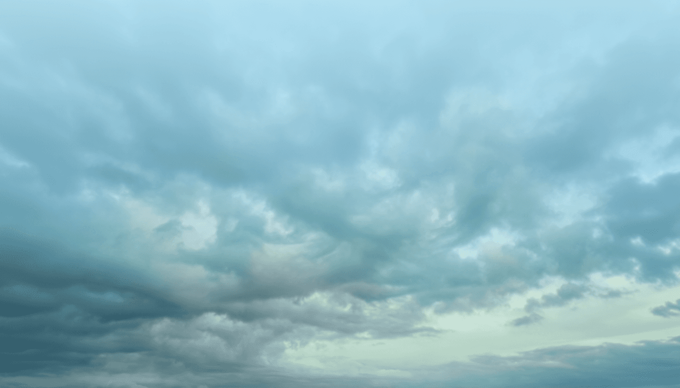 Cloudy sky with grey-blue overcast and soft light.